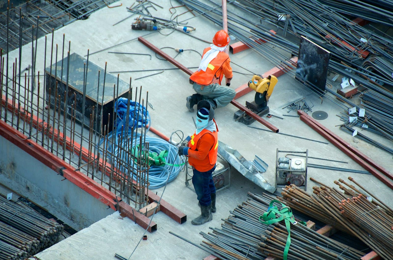 A construction crew working on a roof against an open sky