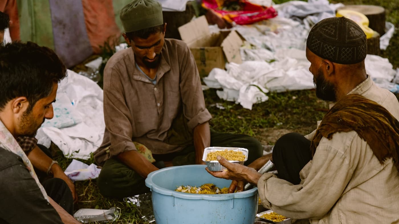 A community meal being served to people at a shared table